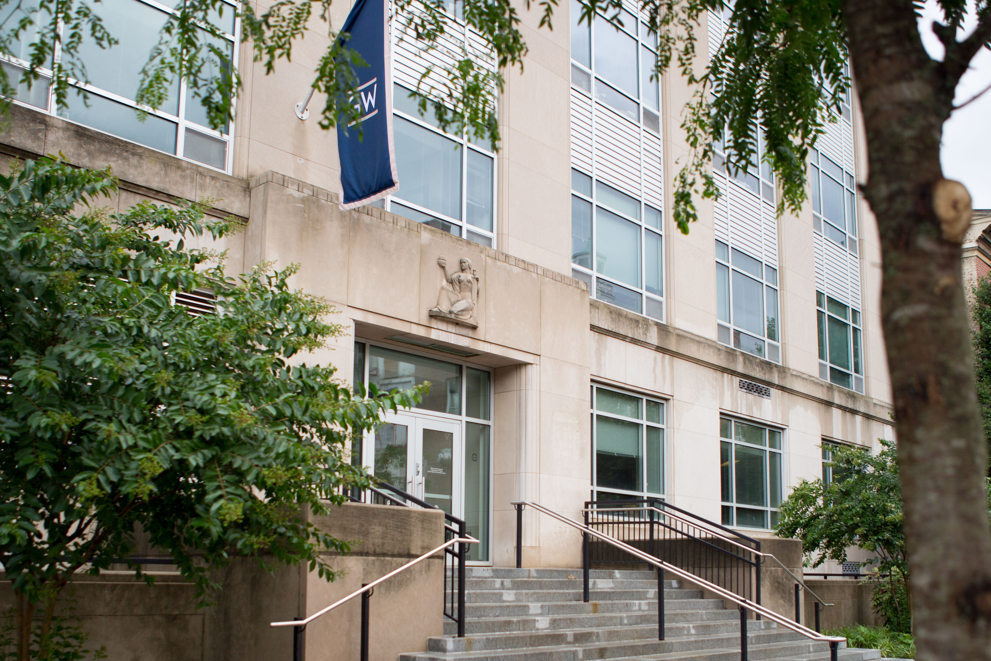 Exterior of Monroe/Hall of Government with a GW flag