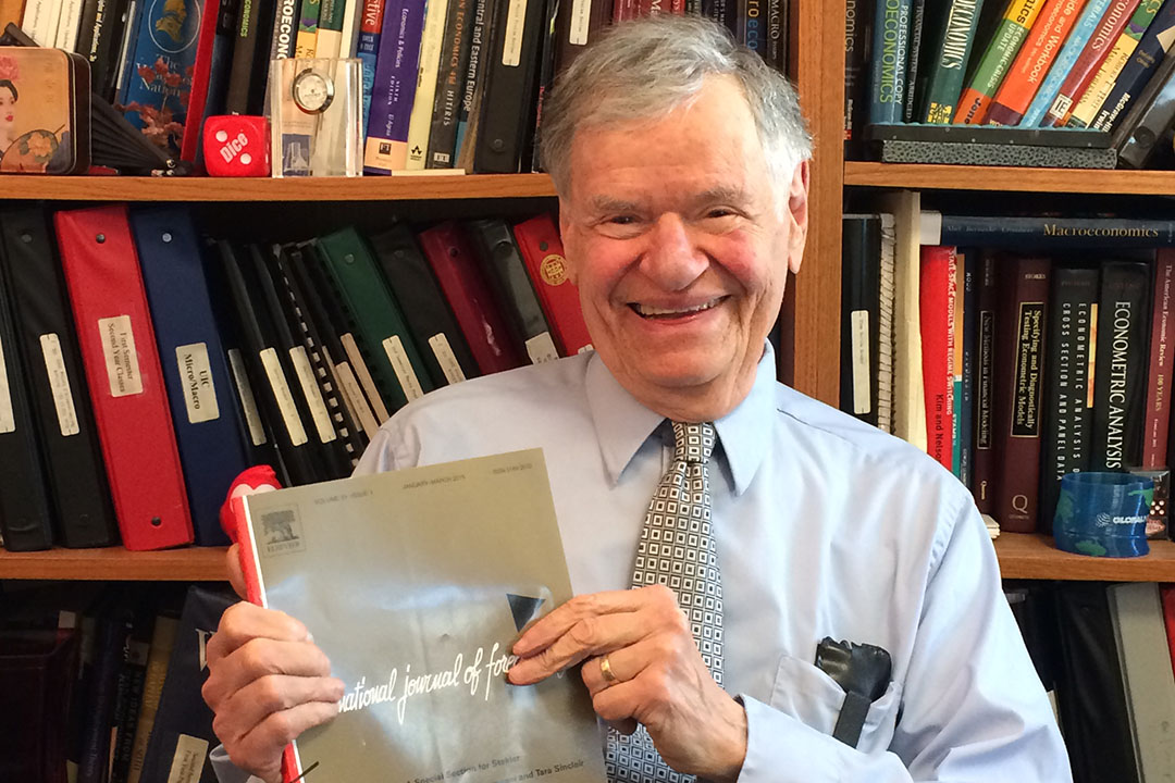 Herman Stekler in 2015 with the issue of the International Journal of Forecasting that included a special section in his honor.